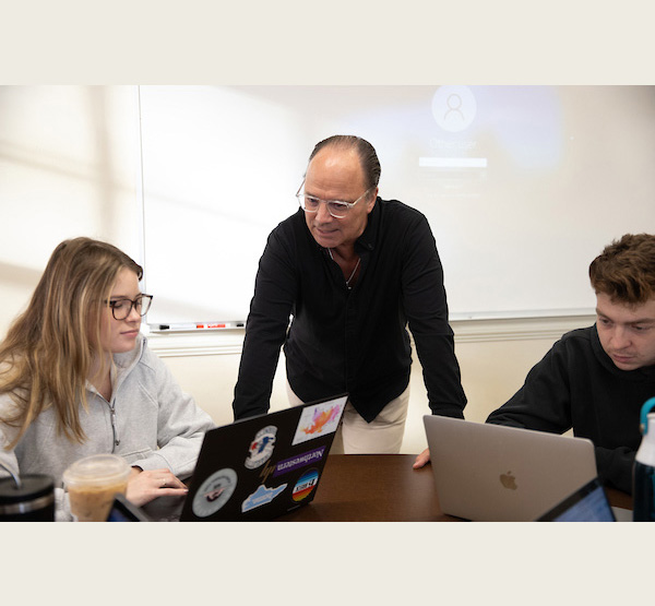 Tim Holcomb with students