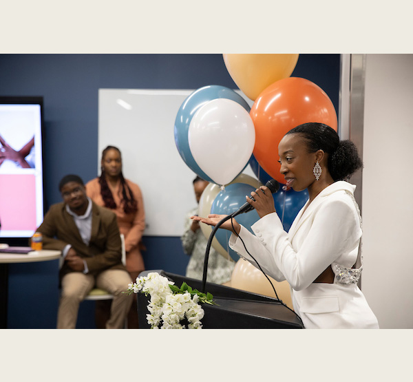 VaLanDria Smith-Lash speaks at the ribbon cutting ceremony for her company, Coarse Culture.