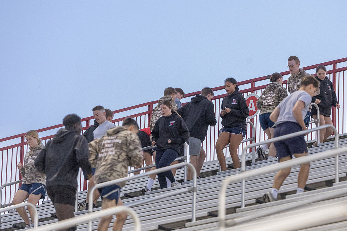 Miami University students climb the stairs at Yager Stadium on Thursday as part of the 9/11 Memorial Stair Climb