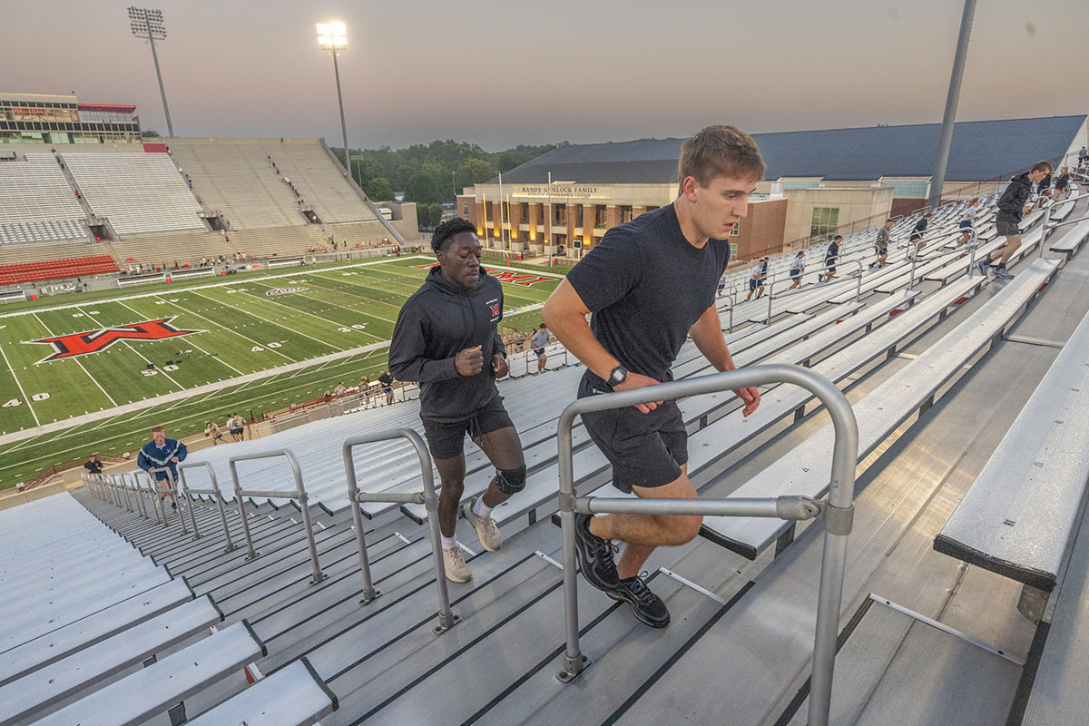 Miami University students climb the stairs at Yager Stadium on Thursday as part of the 9/11 Memorial Stair Climb