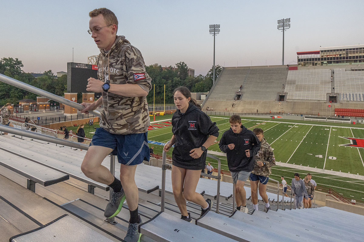 Miami University students climb the stairs at Yager Stadium on Thursday as part of the 9/11 Memorial Stair Climb