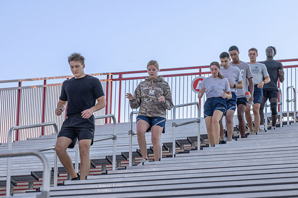 Students climb stairs at Yager Stadium