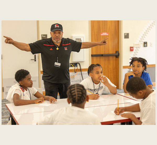 Coates talks to students participating in Camp Excel, a four-day residential program that introduces middle school students from Cincinnati Public Schools and Middletown City Schools to what college is like.