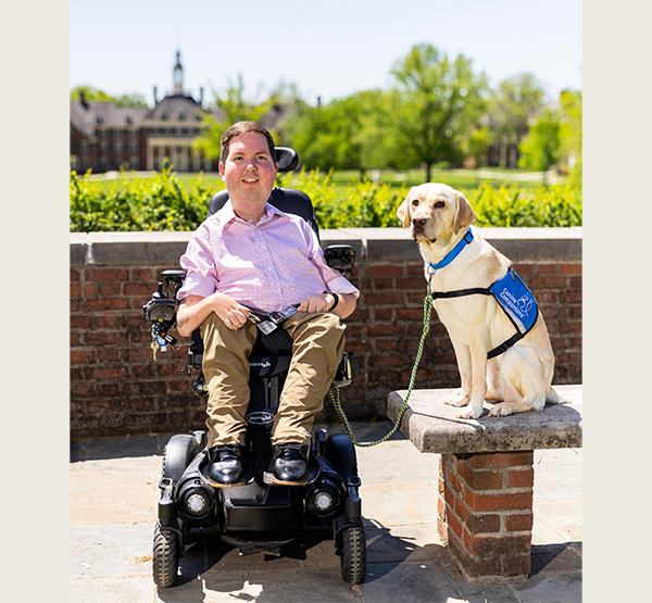 Dan Darkow with his service dog, Kismet, on the Miami University campus.